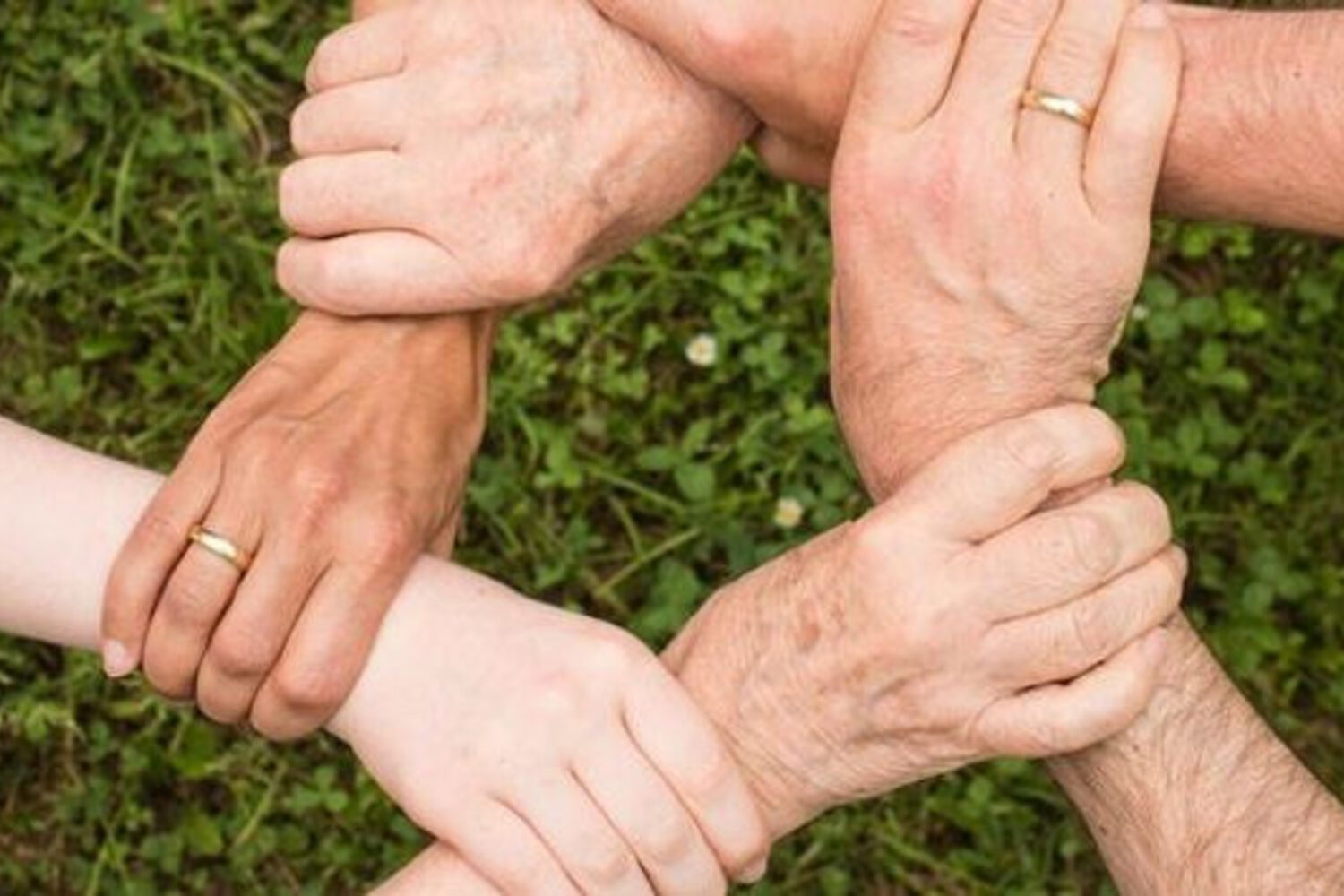 Hands joined together outdoors