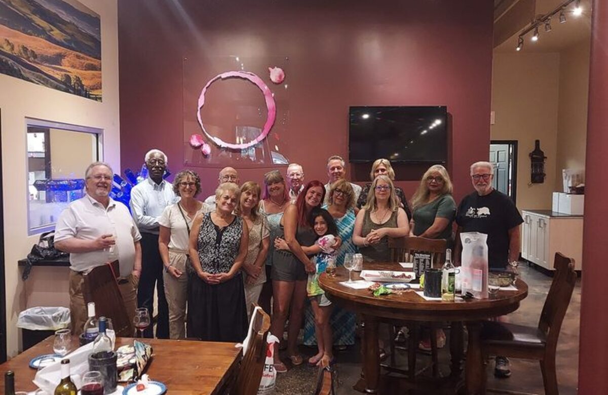 Widow Care members gathered together at an in-person community event