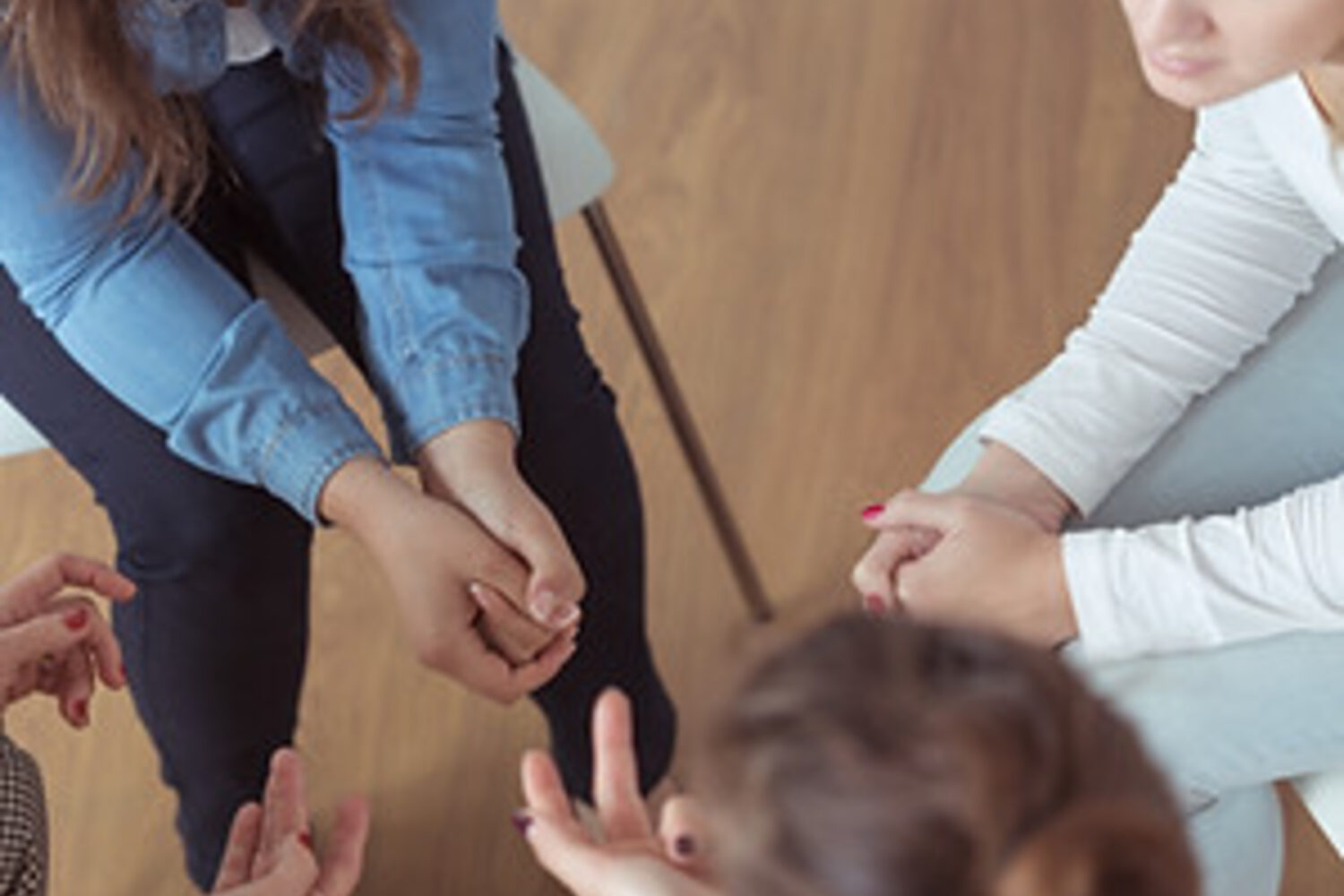 People seated together in a support circle
